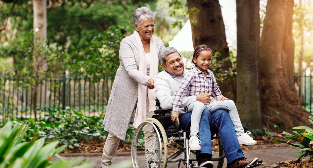 Shot of an adorable little girl playing with her grandparents at the park.